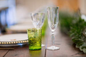 Wedding top table with coloured glassware