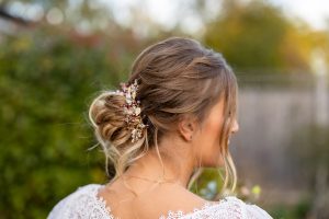 Bridal hair with un-done textured bun and hair vine