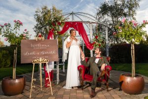 Bride and groom enjoying winter afternoon in Applewood Hall wedding garden